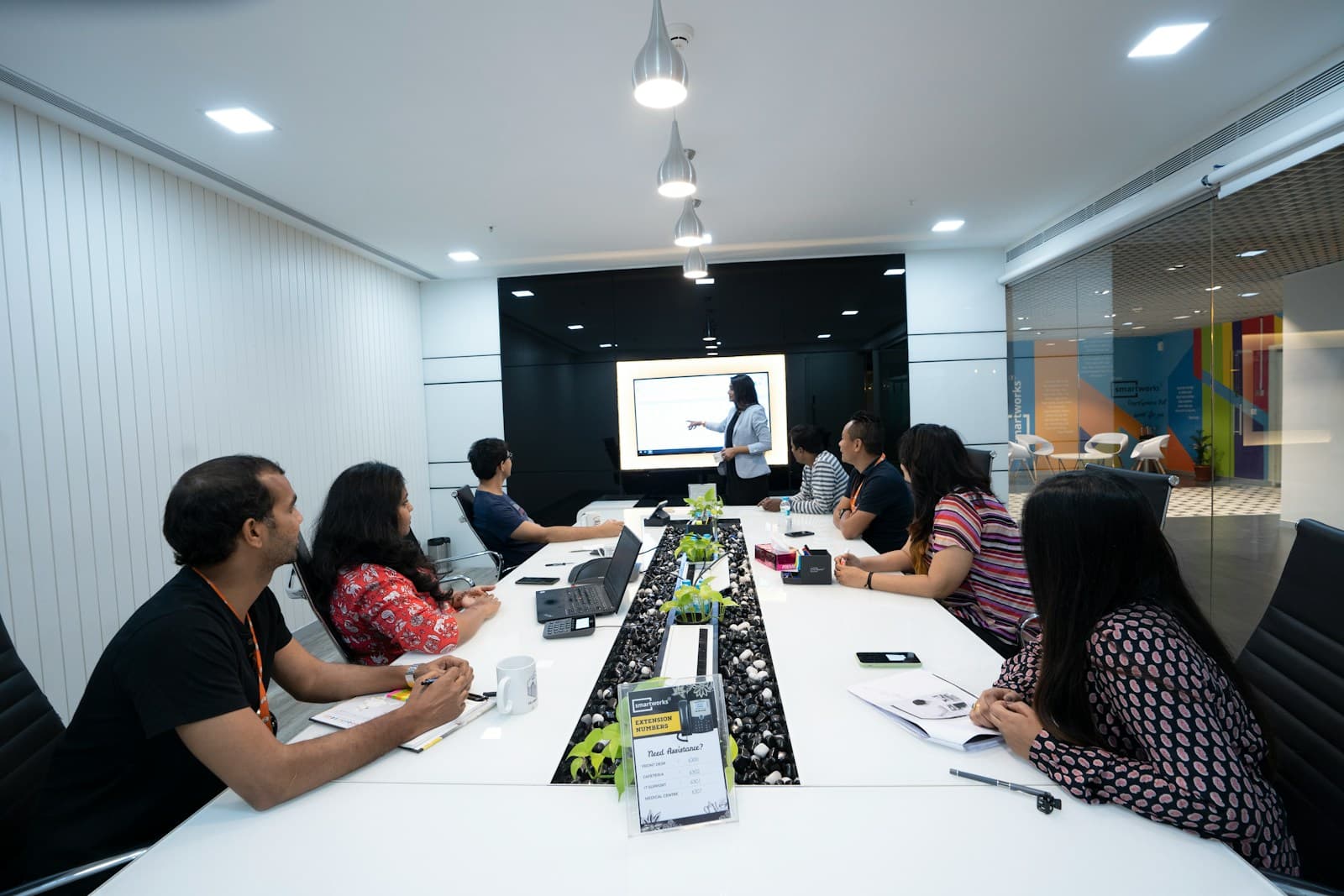 A team reviewing a presentation in a boardroom